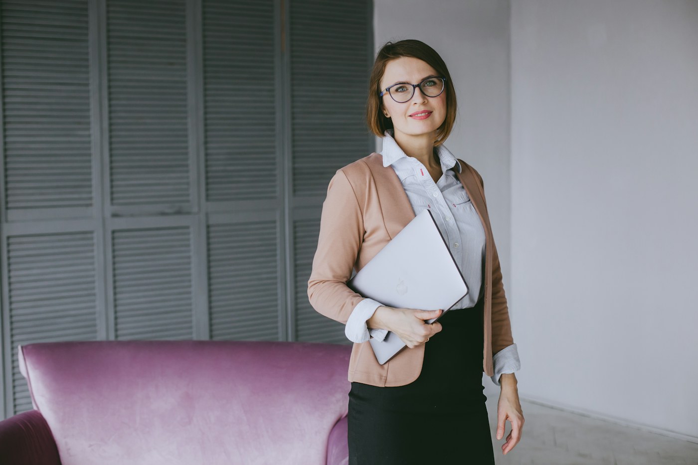 Corporate legal operations candidate holding a laptop