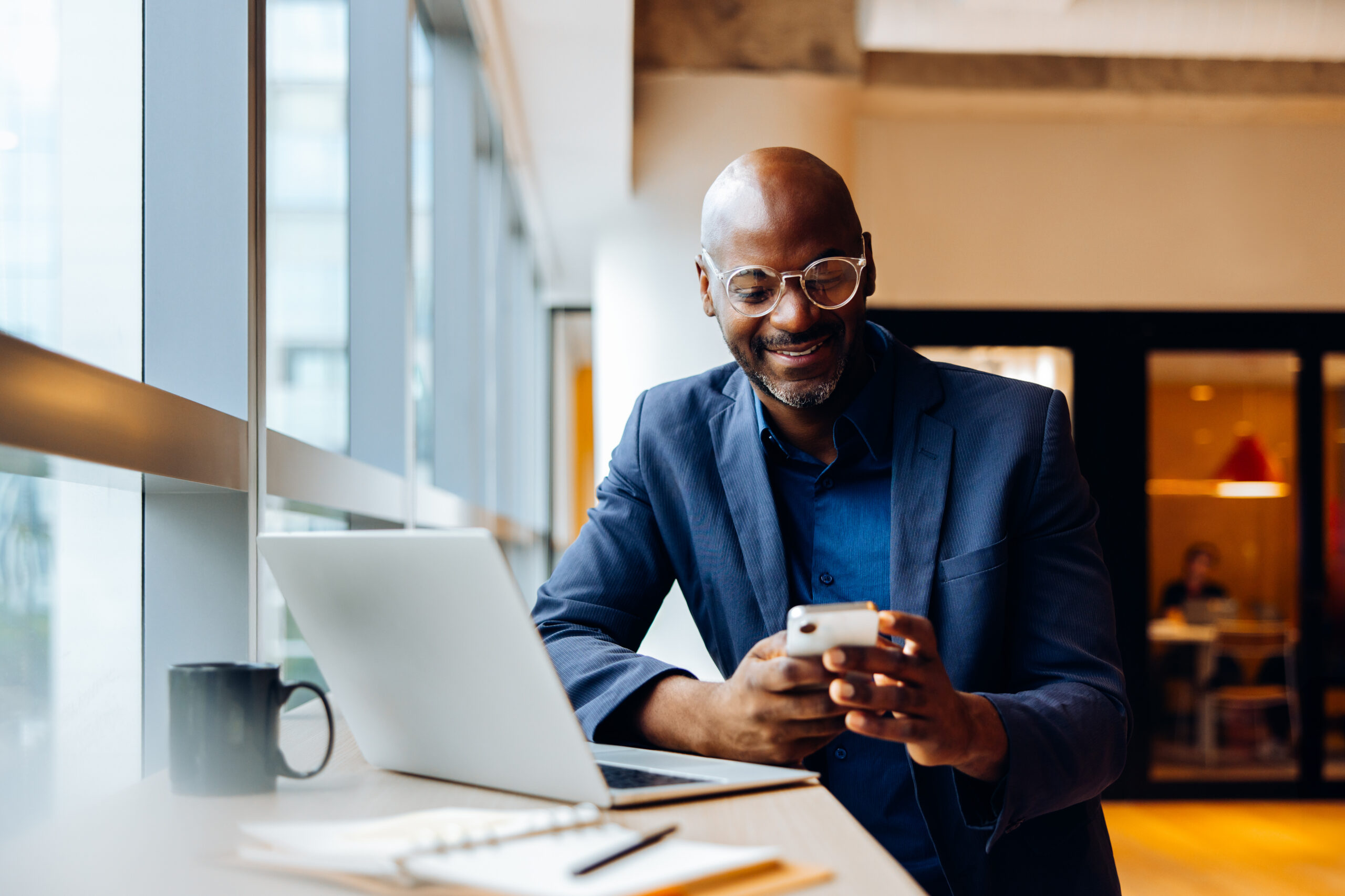 Technology legal professional working with a laptop and mobile phone