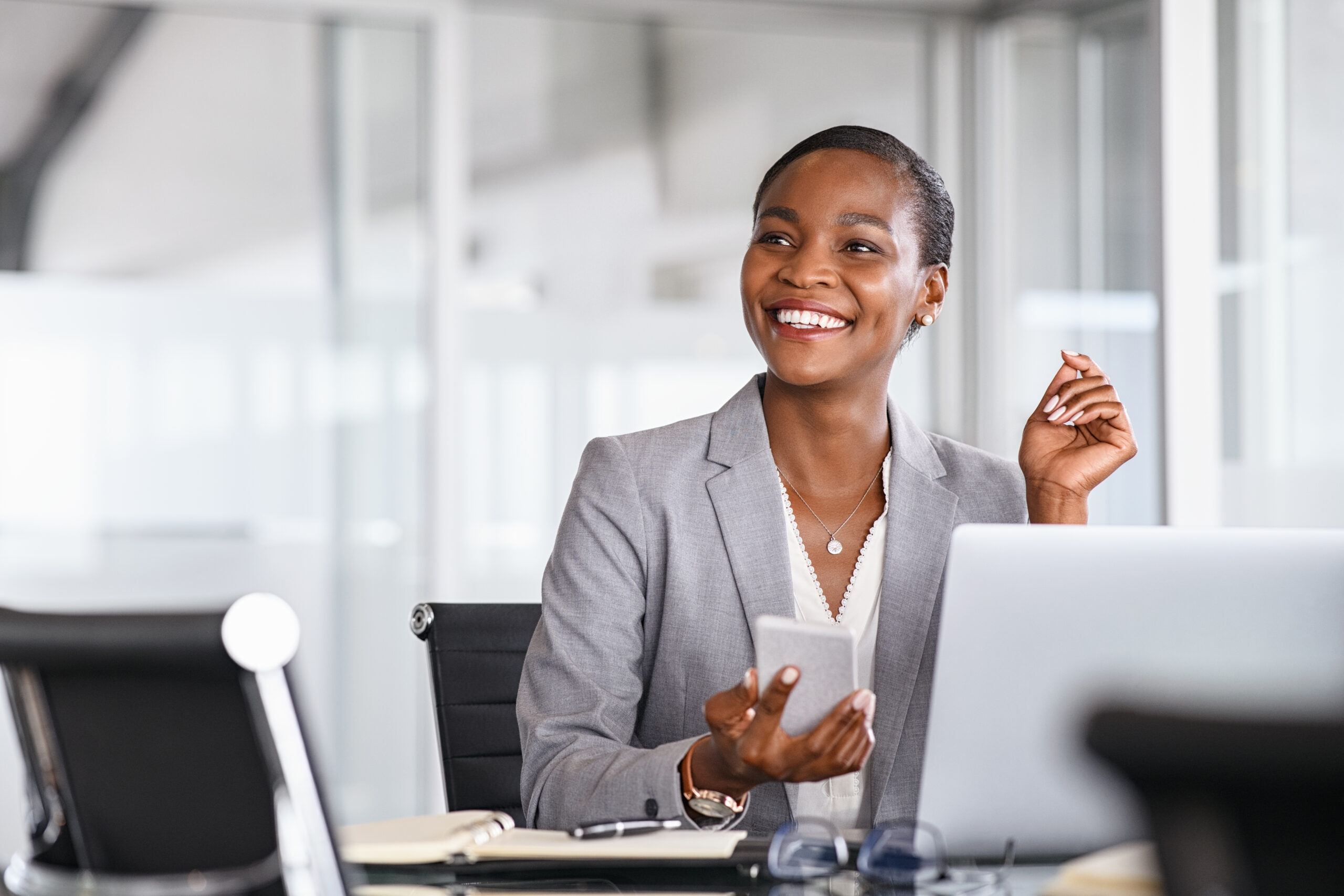 Legal Operations Director reviewing department work at an office desk