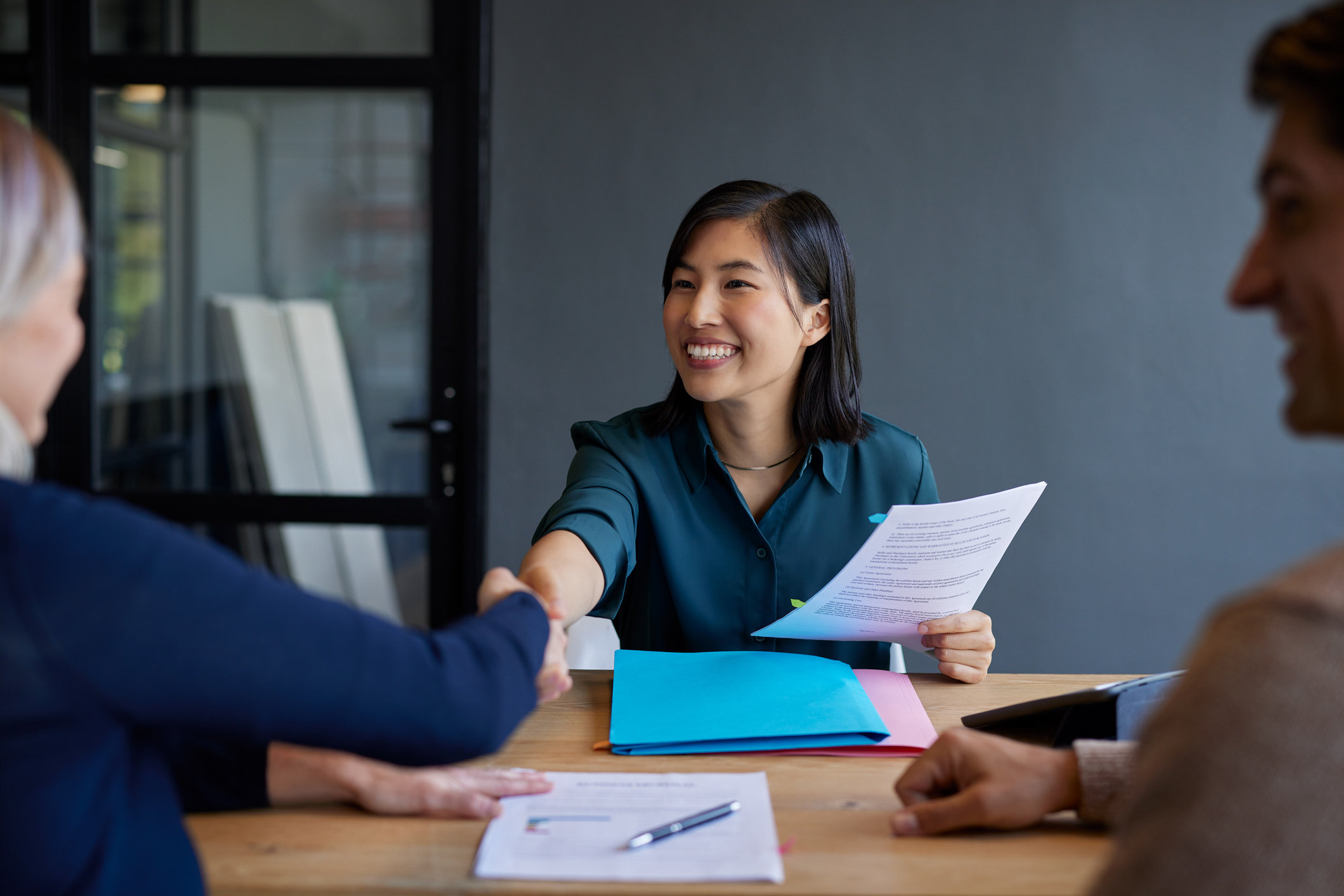 Legal professional and client reviewing a contract together