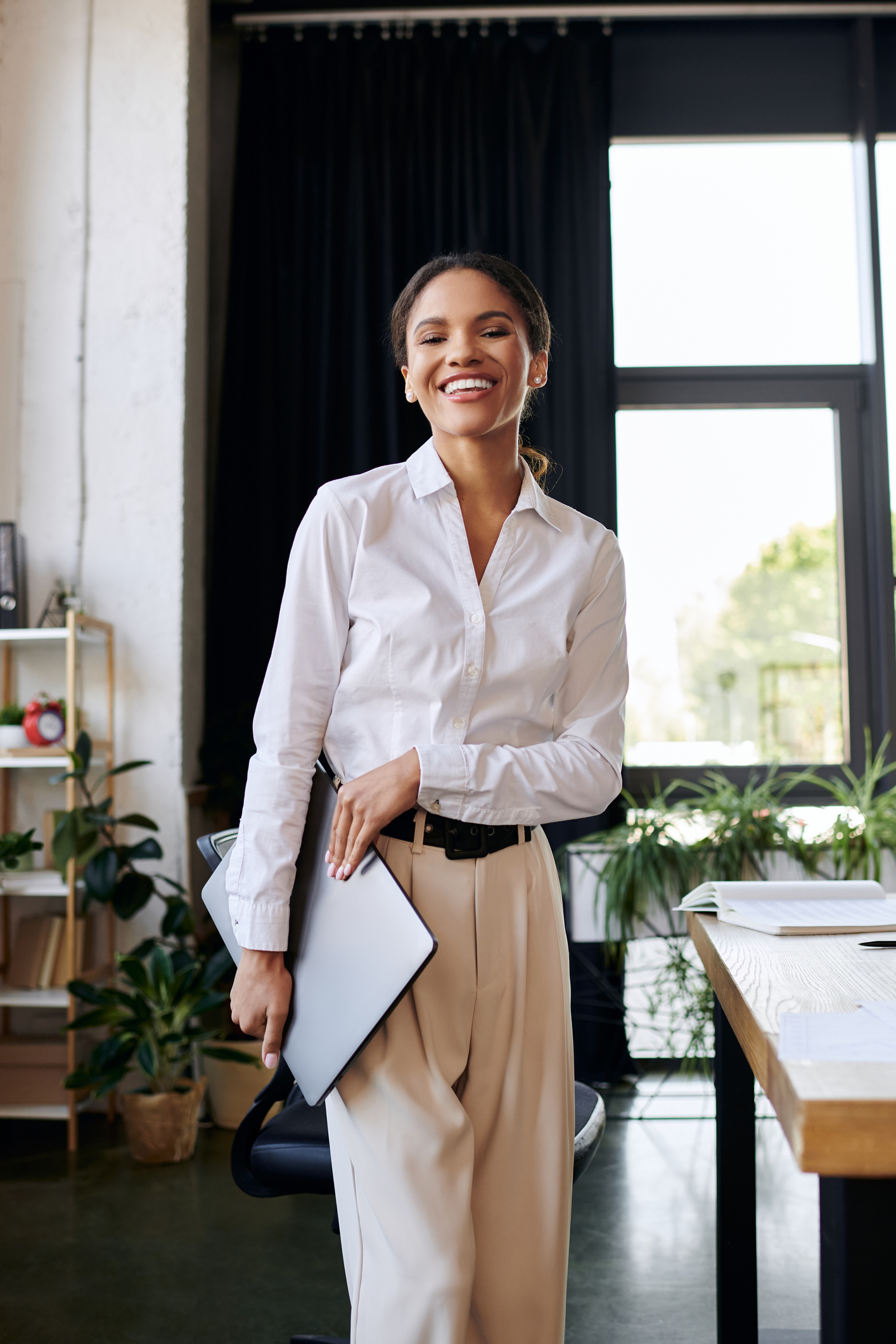Temporary legal professional standing confidently in a bright modern office