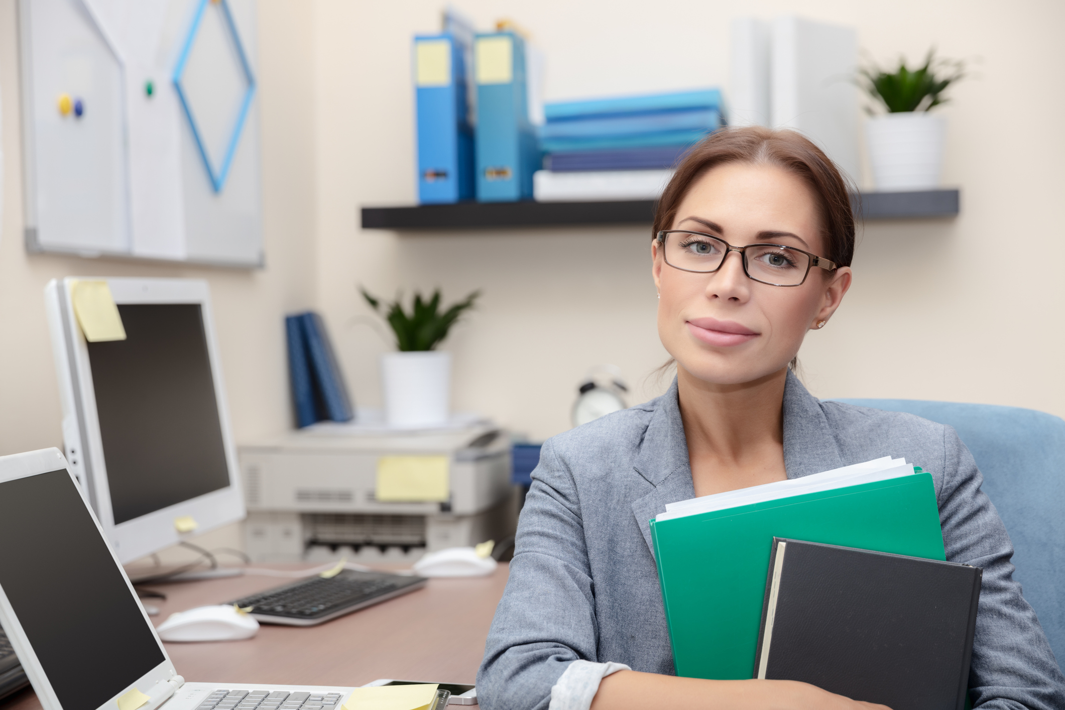 Litigation paralegal working at a computer in a legal office