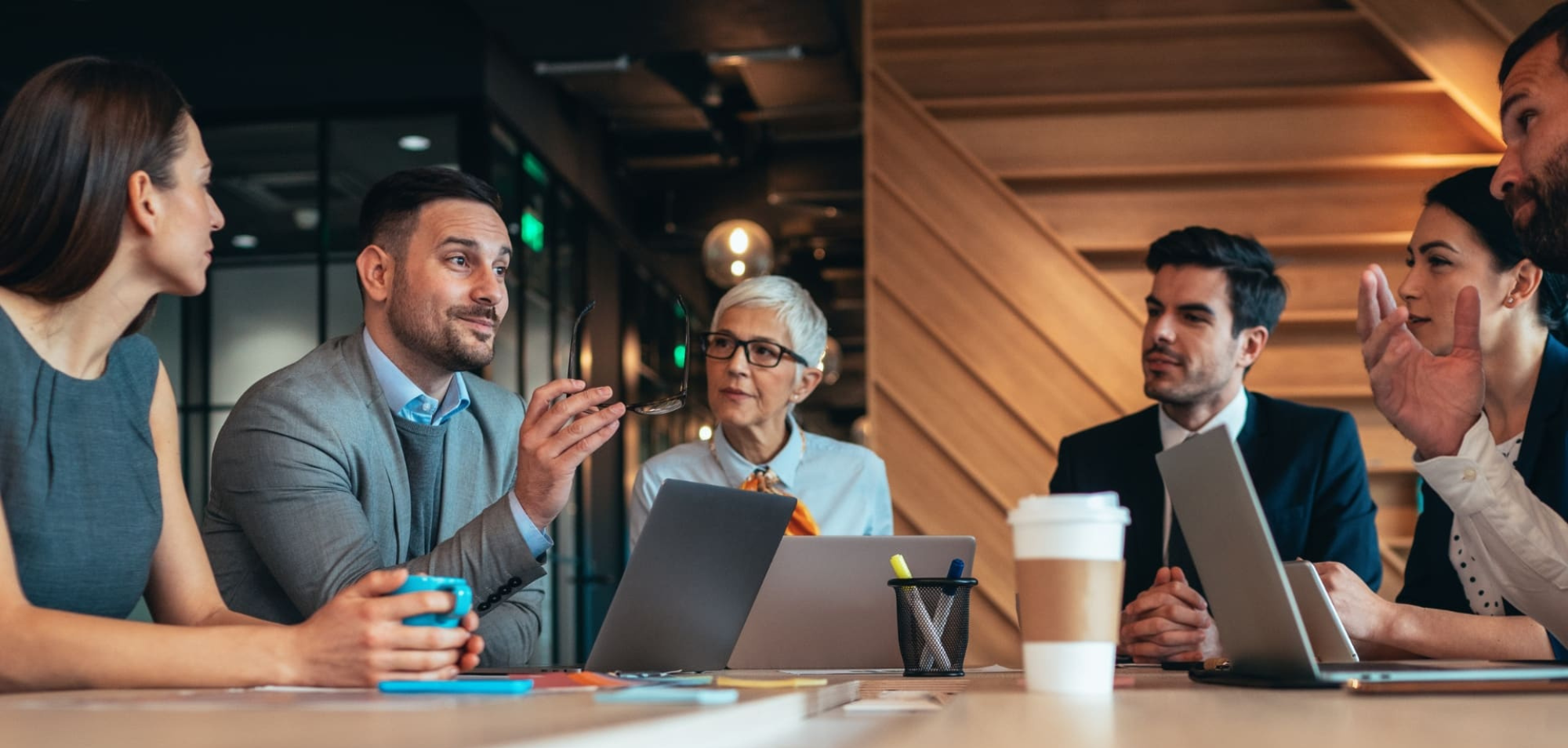 Public-sector legal professionals collaborating around a conference table