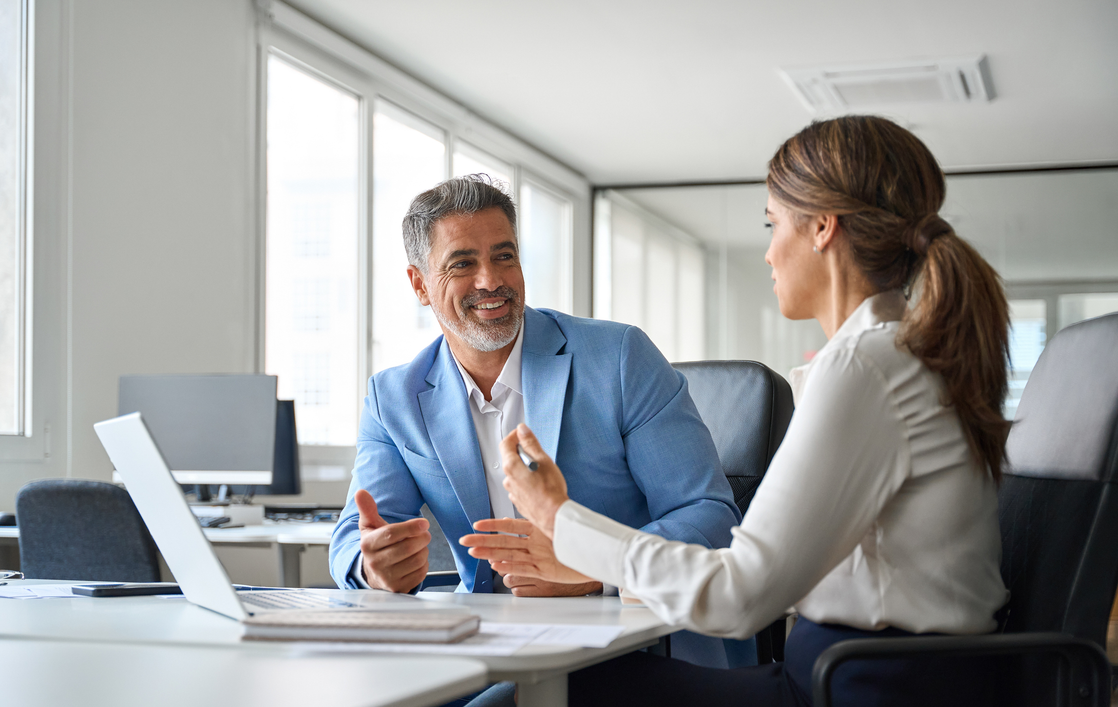Commercial Counsel discussing an agreement with a business colleague