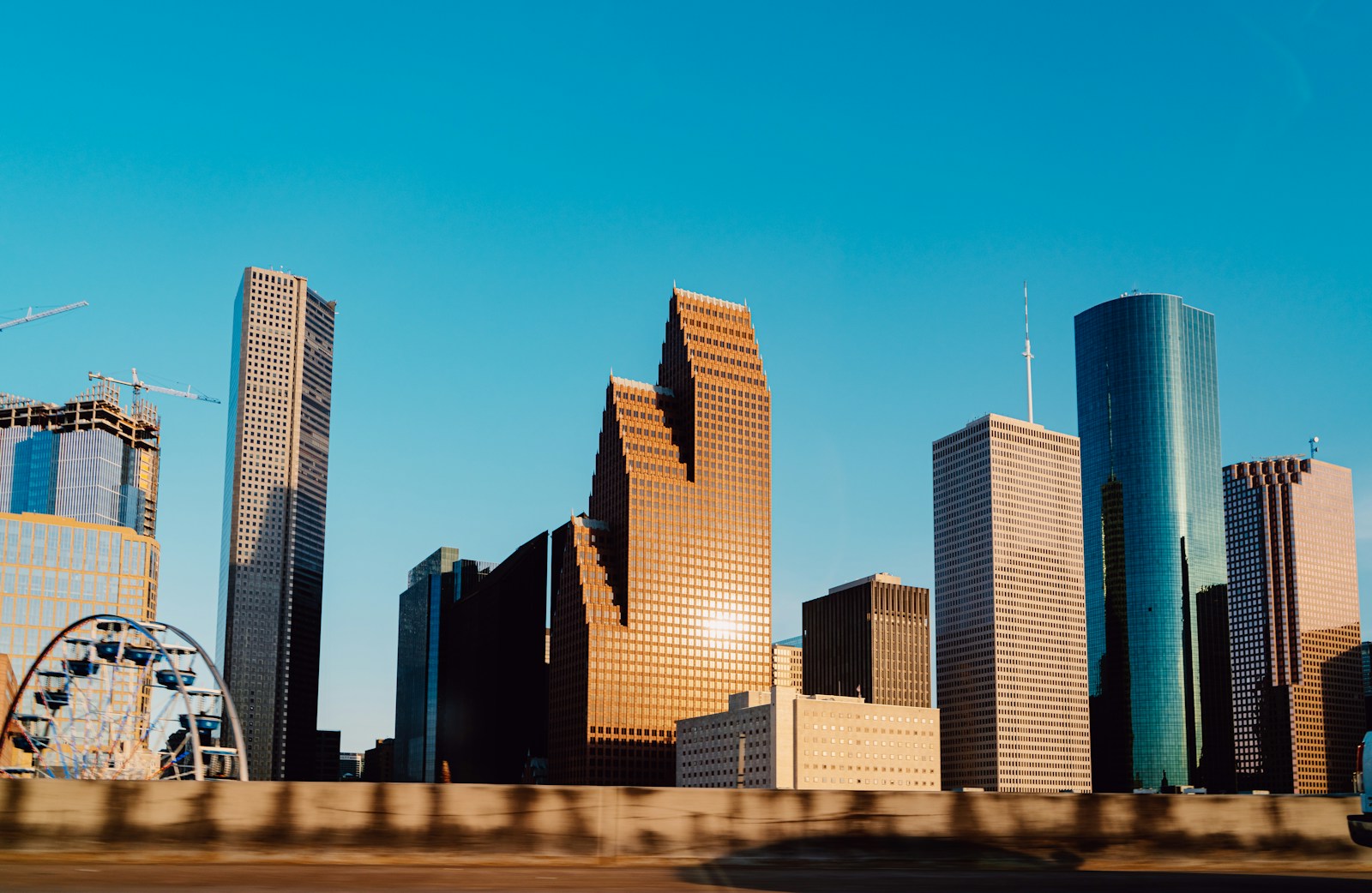 Houston skyline rising above the city at dusk