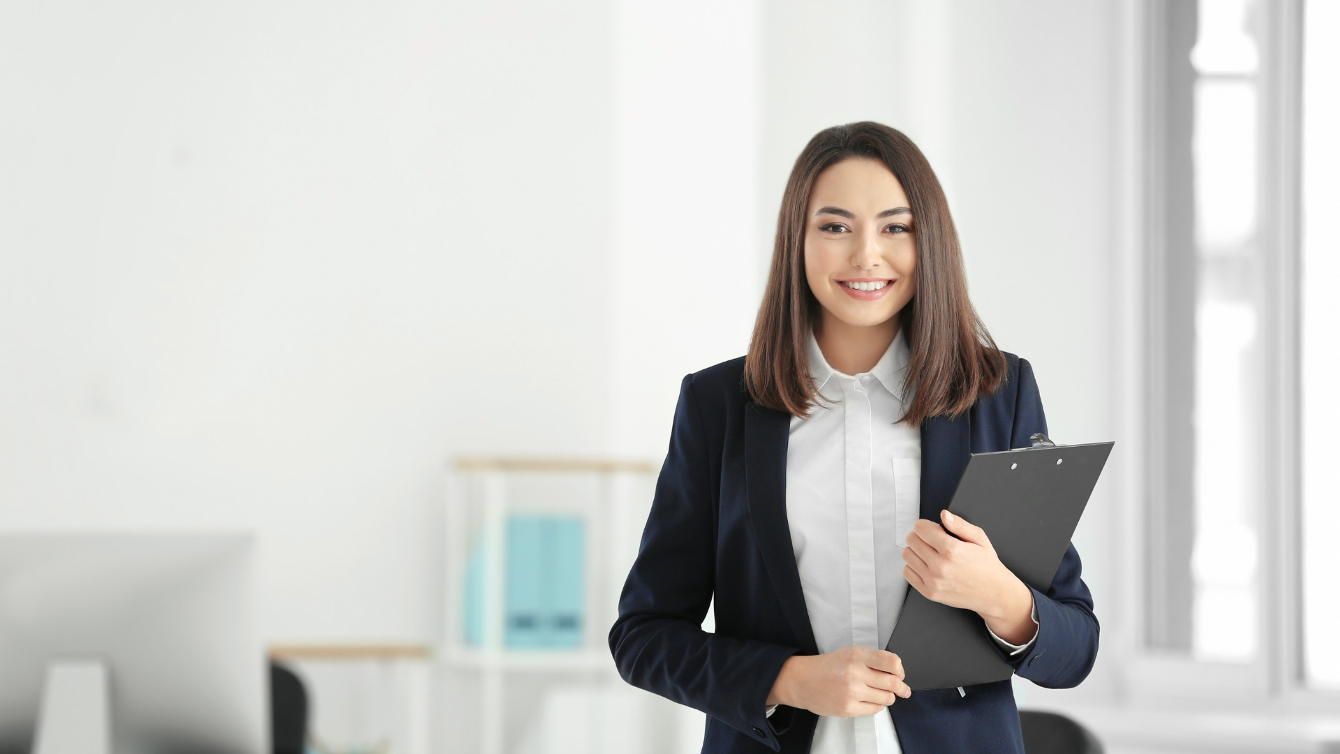 Legal professional holding a clipboard in a Detroit office