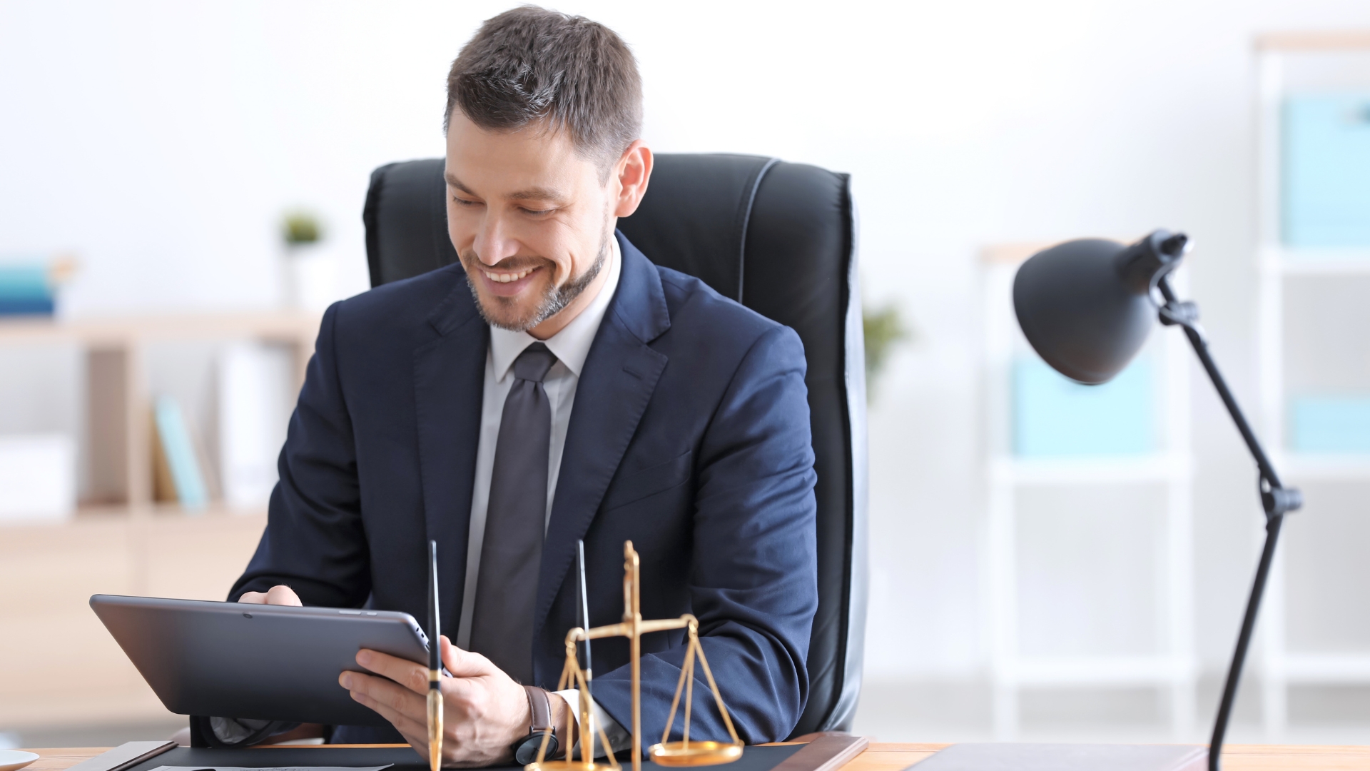 Legal professional working at a desk in a Salt Lake City office
